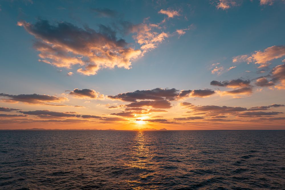 Sunset over open water, photograph 10
