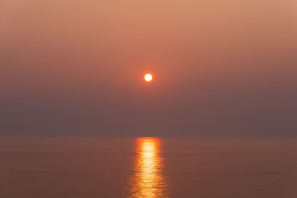 Sunset over open water, photograph 8