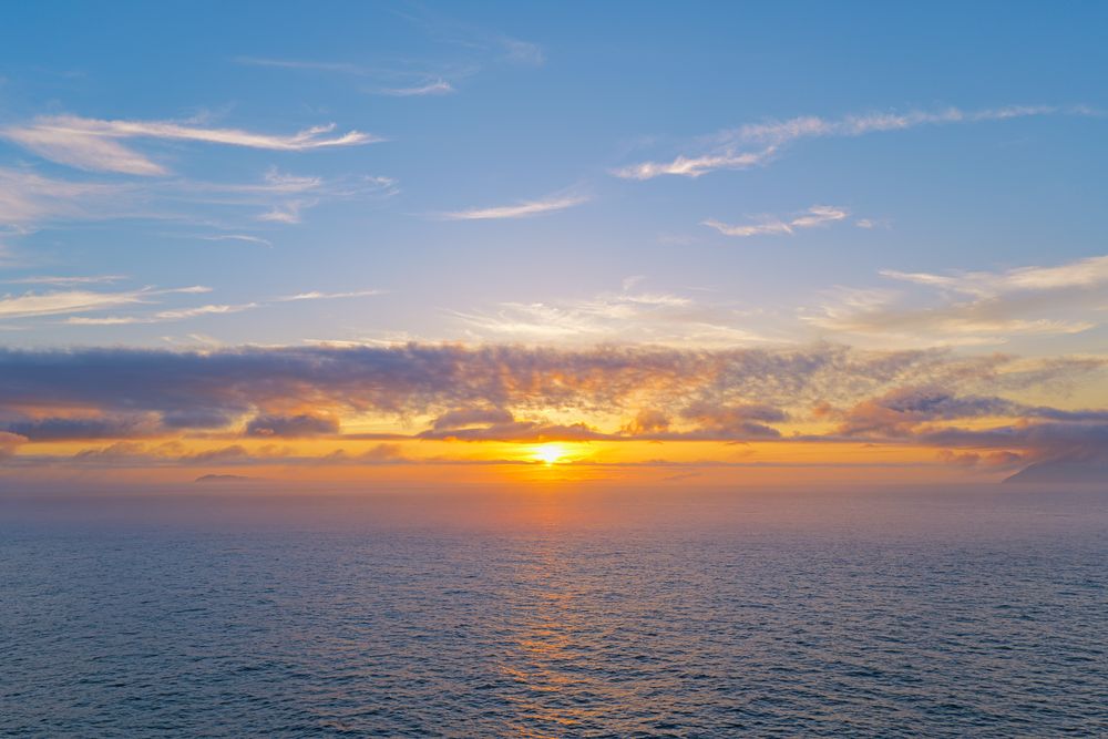 Sunset over open water, photograph 9